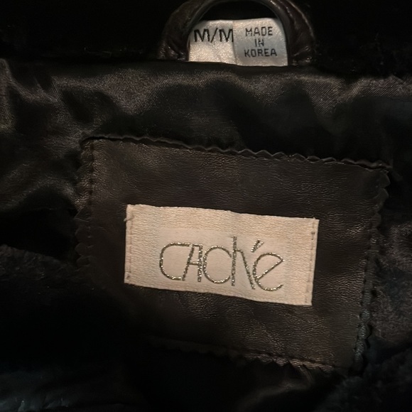 Thick and cozy black leather jacket with fur around the color and wrists. - Picture 4 of 4